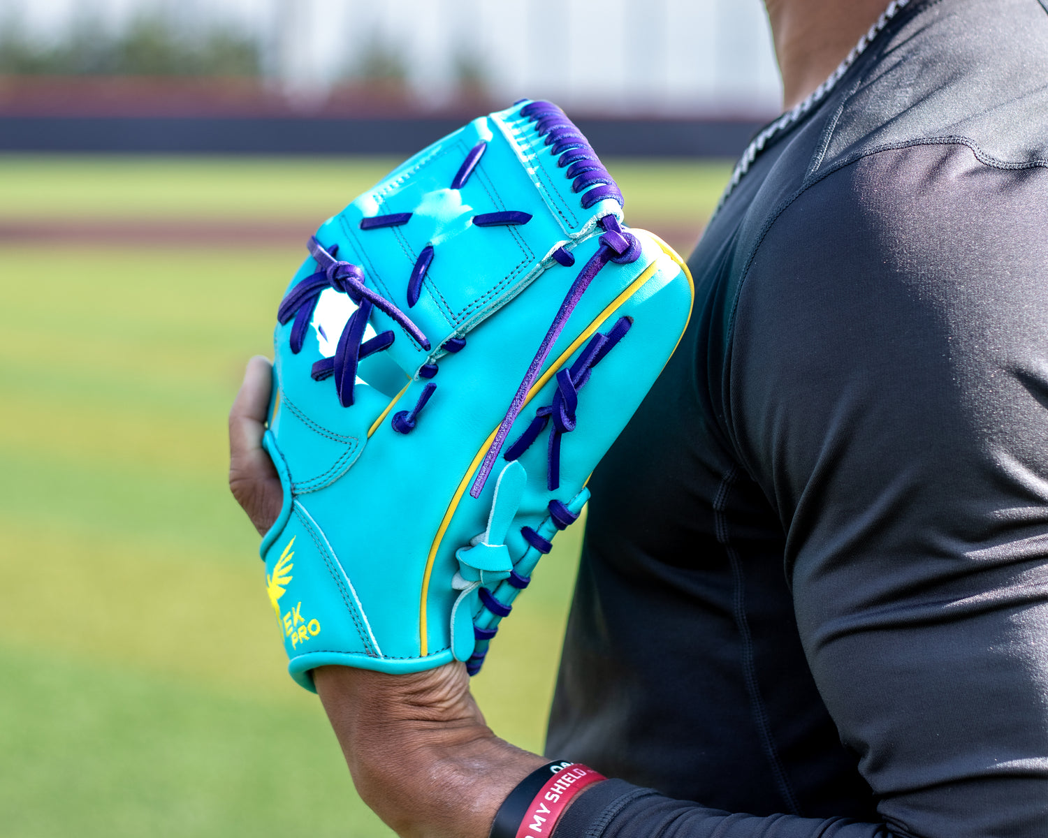 Baseball player holding an aqua blue and purple infield glove