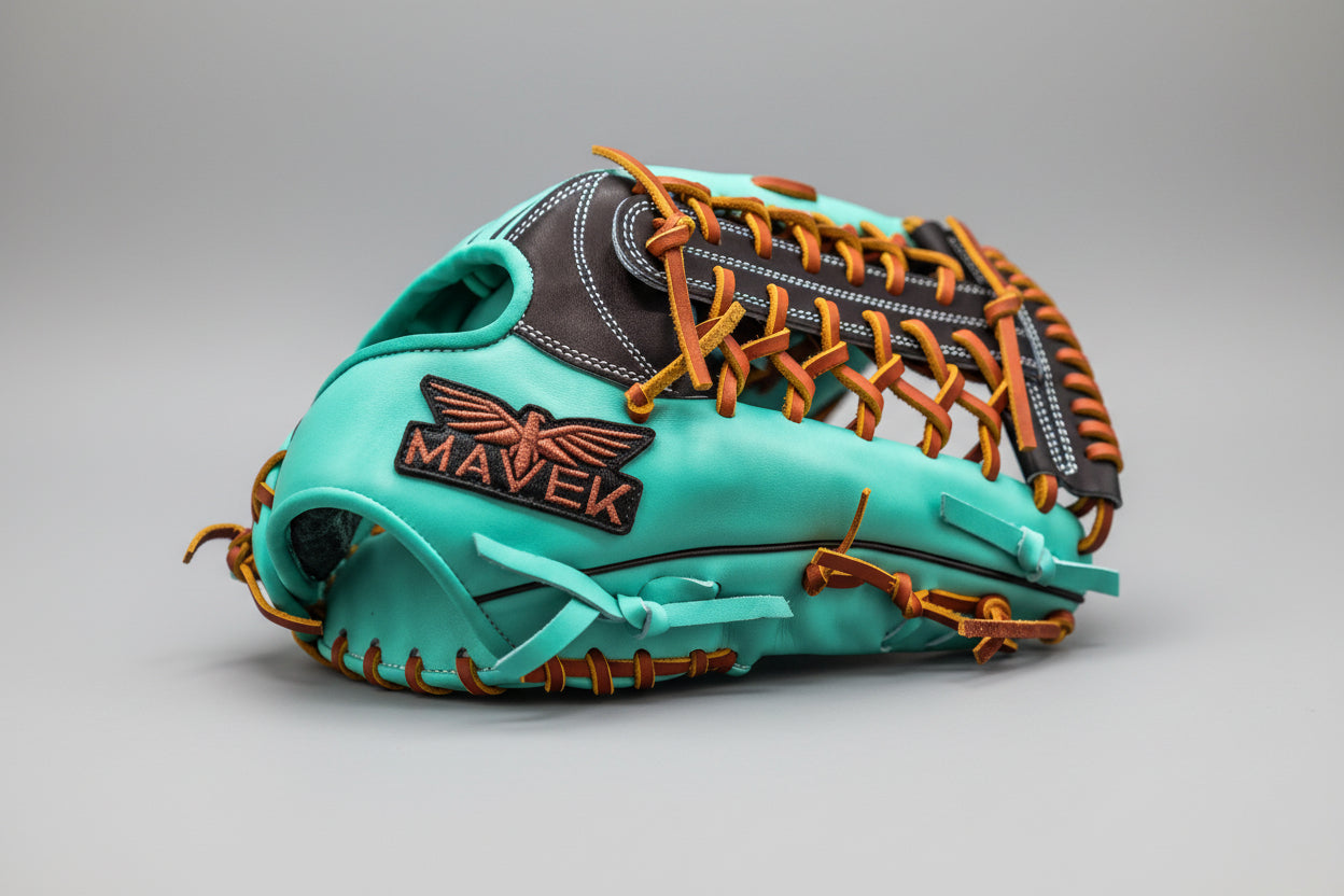 Mint baseball glove with orange stitching on a black background, featuring Mavek logo.
