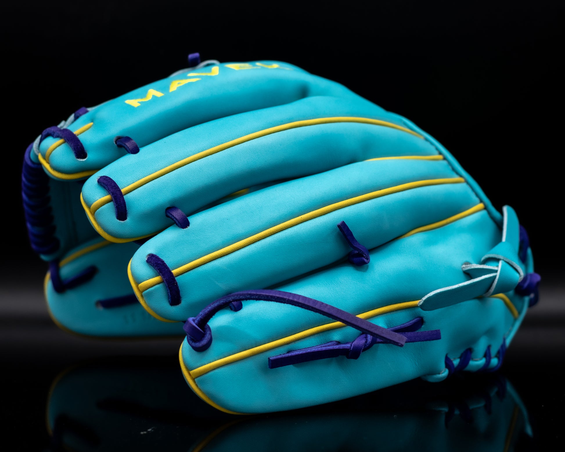 aqua blue glove with yellow piping and purple laces