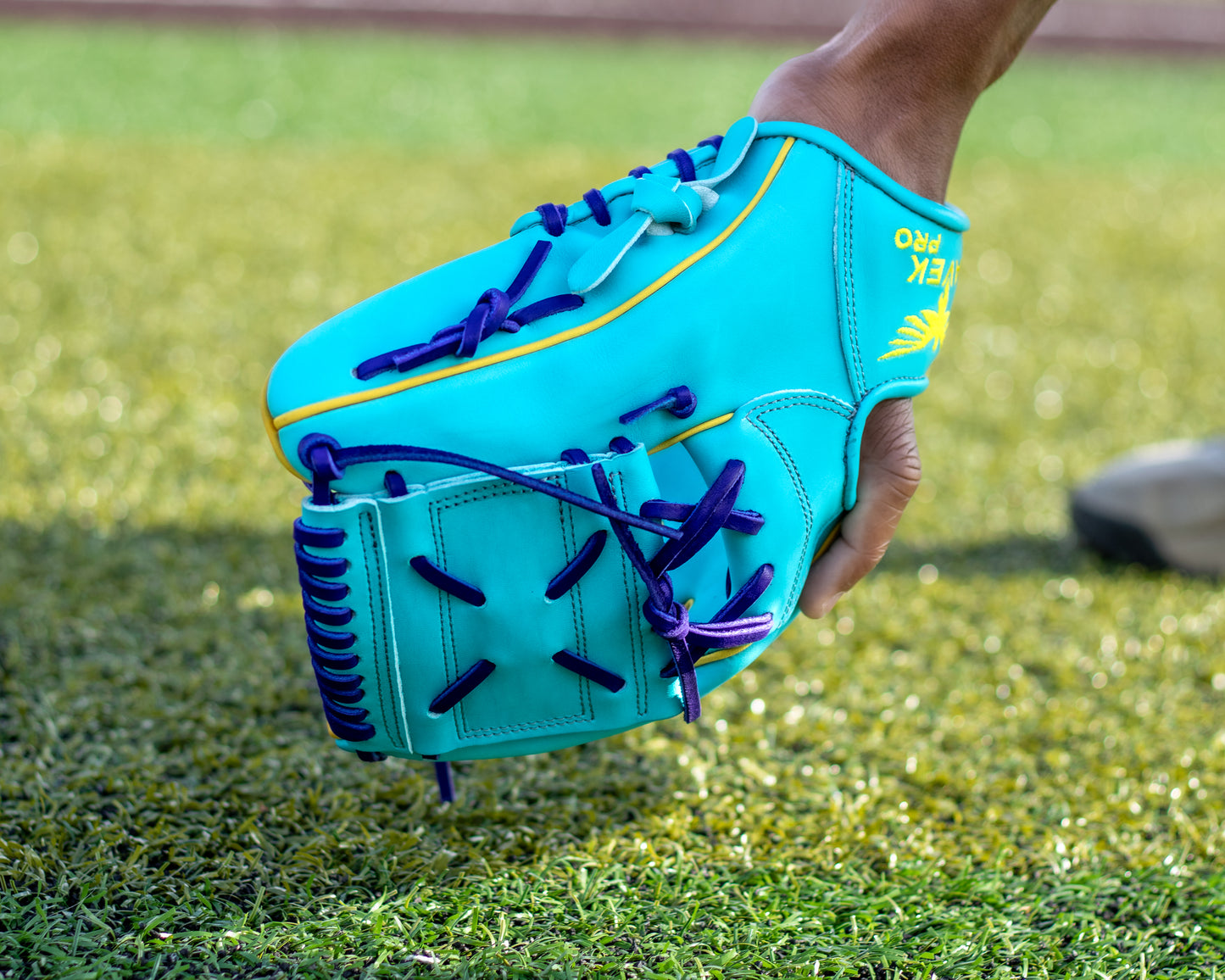 japan kip aqua blue baseball glove with yellow accents and purple laces