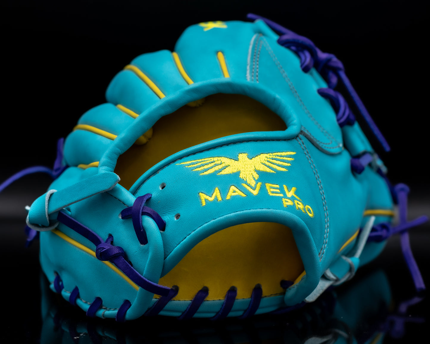 Blue and yellow baseball glove with 'Mavek Pro' branding on a black background